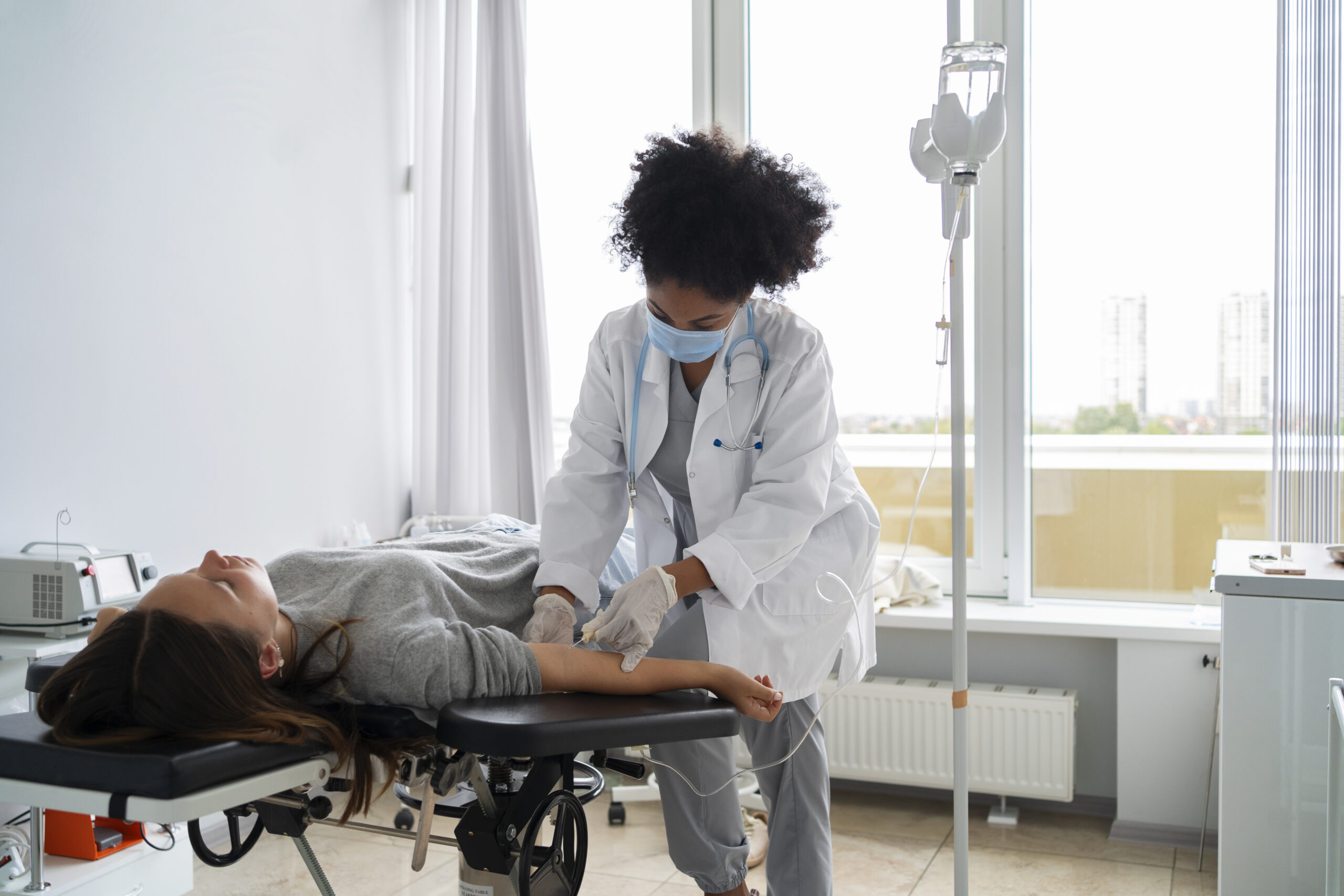 Pelvic Pain black female doctor wearing mask side view